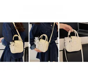 Versatile cream Boston bag shown in crossbody, shoulder, and handheld styles