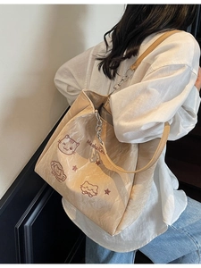 Grand sac cabas beige avec illustration de chat et bandoulière en chaîne
