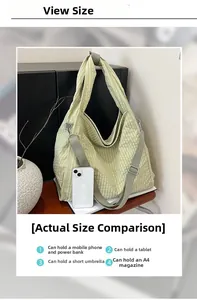 Size comparison of green quilted canvas tote showing capacity for phone and A4 magazine