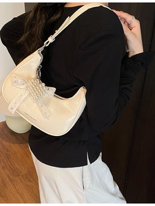 Fashionable cream white crescent shoulder bag with lace bow and pearl heart detail