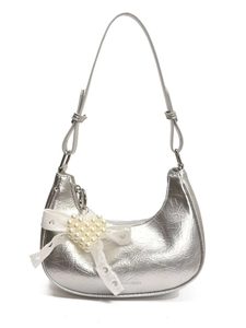 Silver metallic crescent moon handbag with pearl heart charm and lace bow detail