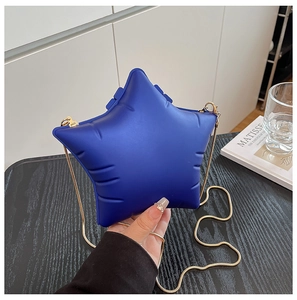 Star-shaped puffer crossbody bag in royal blue with gold snake chain and top metal clasp