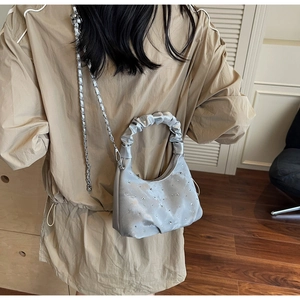 Silver satin pleated dumpling bag with sparkling rhinestones and metal chain strap detail