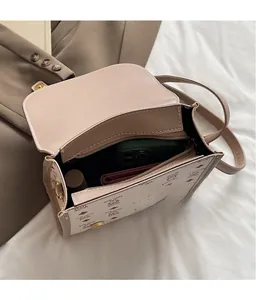 Detail showing the internal multi-layer storage with zipper pocket of the bear print bag