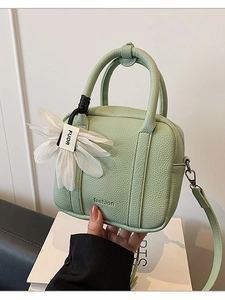 Pale green pebble leather Boston bag with fashion logo and flower charm handle