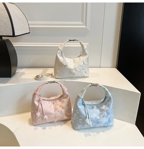 Detailed embroidery view of chic handbags with 3D butterfly patterns and lace textures