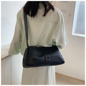 Detailed back view of a black pleated crossbody pillow bag with adjustable shoulder strap