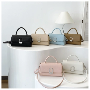 Detail view of stylish woven texture handbags in six colors with metallic square buckles