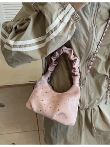 Pink rhinestone pleated dumpling bag with chain strap and shiny leather finish