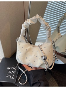 White hobo shoulder bag with sparkling rhinestones and a metallic chain strap
