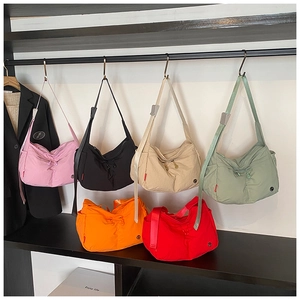 Nylon crossbody bags collection in multiple colors with drawstring pleated details