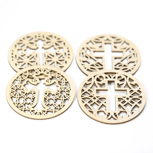 Detailed laser-cut wooden coasters with cross motifs and intricate geometric patterns