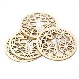 Laser-cut wooden coasters with intricate cross geometric patterns in natural wood finish