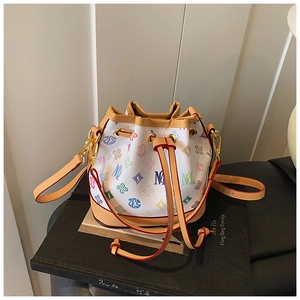 Detail view of mini bucket bag showing multicolor letter print and drawstring closure