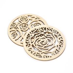 Set of two laser-cut wooden coasters with rose flower patterns for heat insulation