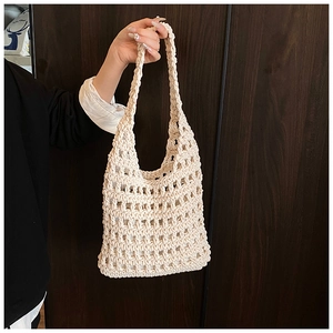 Close-up of cream hollow knit mesh tote bag showing cotton rope texture and inner lining