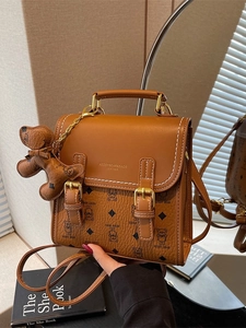 Vintage brown crossbody handbag with bear pattern and cute plush charm for women