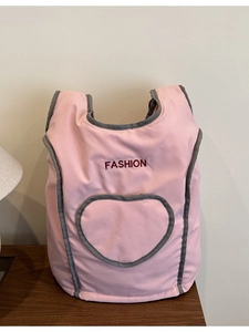 Pink vintage nylon backpack with red FASHION embroidery and a large heart-shaped pocket