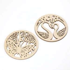 Round laser-cut wooden coasters with elegant butterfly and swan heart patterns