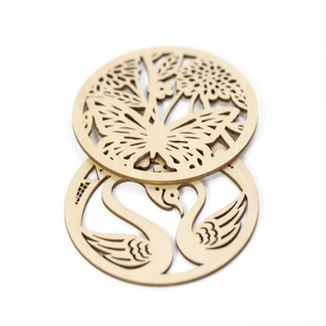 Detailed laser-cut wooden coasters featuring butterfly, flower, and swan heart patterns