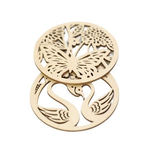 Laser-cut wooden coasters with butterfly floral and swan heart patterns on white background