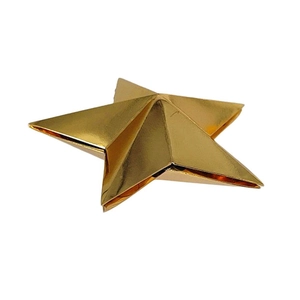 3D gold star decoration with metallic mirror finish for festive party setting