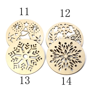 Detailed laser-cut wooden Christmas ornaments with snowflake and star hollow patterns
