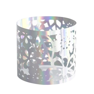 Detailed laser-cut hollow floral pattern on a silver iridescent party candle holder