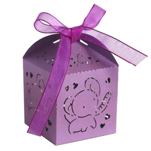 Detail of laser-cut elephant and heart hollow design on purple cardstock favor box