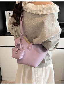 Minimalist lavender bucket bag with matching mini pouch and adjustable shoulder strap