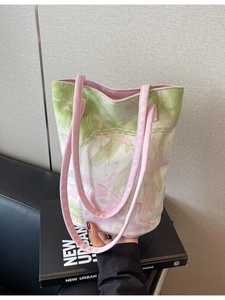 Floral canvas tote bag with pink straps and green floral pattern in a fresh style