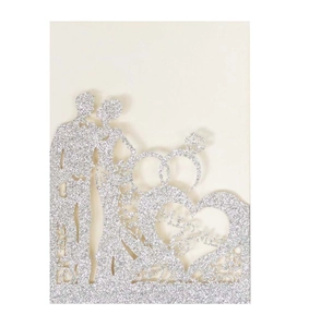 Detailed silver glitter laser-cut wedding invite with Mr & Mrs text and couple silhouette