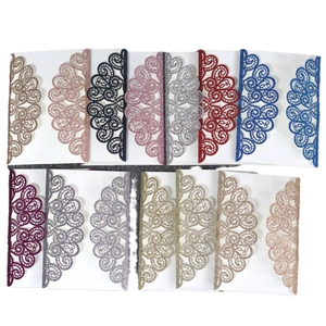 Glitter laser-cut invitation covers in various colors with intricate floral patterns