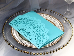 Exquisite laser cut lace wedding invitation card detail in elegant tiffany blue paper
