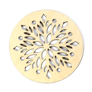 Round wooden snowflake coaster with intricate cutout design for Christmas table decor