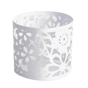 Detailed view of white laser-cut paper lampshade with floral hollowed pattern