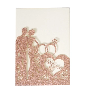 Laser cut rose gold glitter wedding invitation with Mr & Mrs rings and heart design