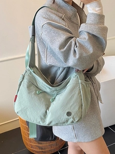 Light mint green nylon hobo bag with adjustable wide shoulder strap for women