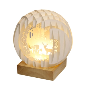 3D Christmas paper cut spherical night light with snowman and reindeer on wooden base