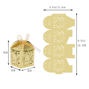 Detail of laser-cut gold elephant favor box with ribbon and flat template dimensions