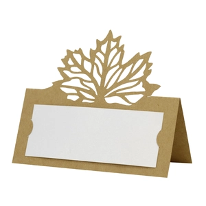 Detailed laser-cut maple leaf place card in brown kraft paper for autumn table setting