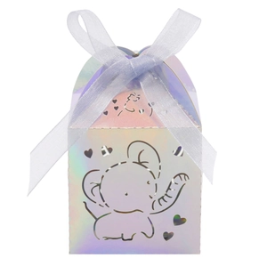 Close-up of pink iridescent elephant candy box with cutout heart and blue ribbon tie