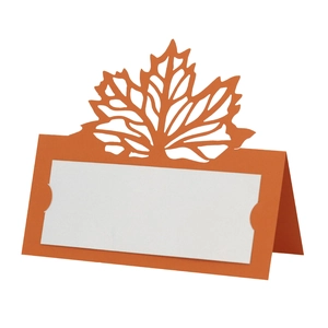 Macro shot of 3D laser-cut orange maple leaf place card with white name section