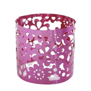Magenta laser-cut metal candle holder with elegant floral pattern for home decor