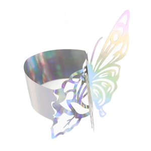 Detail of laser-cut iridescent butterfly napkin ring with hollow design for festive table