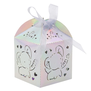 Detail of laser-cut elephant and heart patterns on iridescent gold party favor box