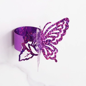 Detail view of purple laser-cut butterfly napkin ring with sparkling glitter finish