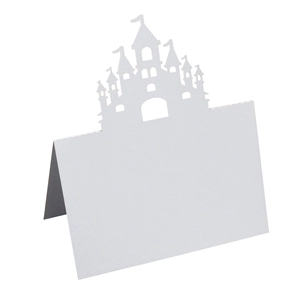Detailed laser-cut castle design on a white pearlescent paper table name place card