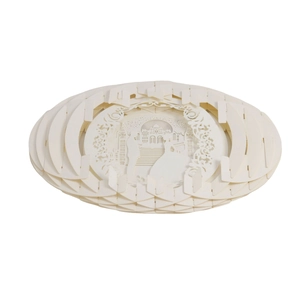 Detailed laser-cut paper art lamp showing multi-layer castle and couple scene