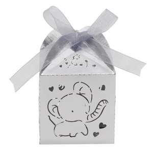Detail of pink hollow elephant candy box with heart patterns and satin ribbon bow